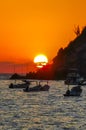 Colorful golden sunset boats wave and beach Puerto Escondido Mexico Royalty Free Stock Photo