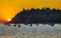 Colorful golden sunset boats wave and beach Puerto Escondido Mexico