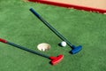 colorful golf putters with golf balls on synthetic grass Royalty Free Stock Photo