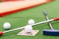 colorful golf putters with golf balls on synthetic grass Royalty Free Stock Photo