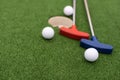 colorful golf putters with golf balls on synthetic grass Royalty Free Stock Photo