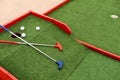 colorful golf putters with golf balls on synthetic grass Royalty Free Stock Photo