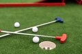 colorful golf putters with golf balls on synthetic grass Royalty Free Stock Photo