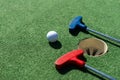 colorful golf putters with golf balls on synthetic grass Royalty Free Stock Photo