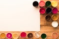 Colorful gouache jars with open caps and blank watercolor paper. Copyspace. Top view Royalty Free Stock Photo