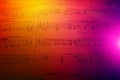 Colorful Gradient Background of Sheet Music with Musical Notes and Abstract Design Elements Royalty Free Stock Photo