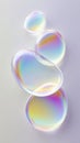 Colorful gradient soap bubbles floating gracefully against a soft background reflecting light at various angles. Royalty Free Stock Photo