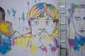 Colorful graffiti of Angela Merkel on a wall in Friedrichshain Berlin Germany