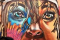 Colorful graffiti art and street murals. Beautiful woman`s eyes.