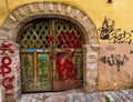 Colorful Graffiti on a Closed Entrance Door of an Industrial Building.