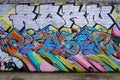 Colorful graffiti covers a brick wall, featuring layered and interwoven letters. Shoreditch, UK Royalty Free Stock Photo
