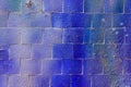 Colorful graffiti painted on a decorative brick like tiles. Abstract urban background. Spray painting art Royalty Free Stock Photo