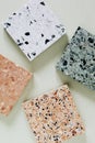 Colorful granite cubes on background