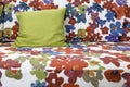 Colorful graphic flower print fabric sofa with green silk pillow