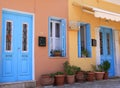 Colorful Greek Homes with Blue Window Shutters and Doors in Symi Island Royalty Free Stock Photo