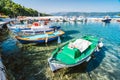 Colorful Greek local fishing boats in small port harbor of Kioni on Ithaka island, Greece