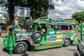 Colorful green old american jeepney used as a public transpor