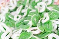 Colorful green, white candies as background