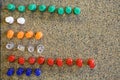 Colorful green white orange clear red blue push pins in bulletin board Royalty Free Stock Photo