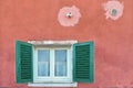 Colorful green window and orange old building facade in beautiful village Lerici, Liguria Italy