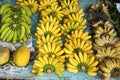 Colorful bunches of bananas and other tropical fruit at a market in Vietnam