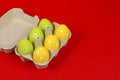 Colorful Easter eggs in a group with smiley face on a red background Royalty Free Stock Photo
