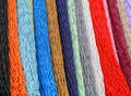 Colorful grid of cord hanging vertically in the form multi-colored background