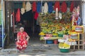 Colorful grocery shop and local woman in Kataragama, Sri Lanka