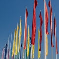 Colorful Groups of Flags against Blue Sky