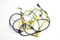 Tangled colorful guitar cable on white background