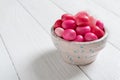 Colorful gum in a bowl on a white wooden background Royalty Free Stock Photo