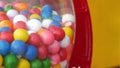 Colorful gumballs in classic vending machine, USA. Multi colored buble gums, coin operated retro dispenser. Chewing gum candies as