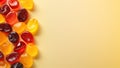 Colorful Gummy Candies on Yellow Background