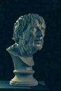 Colorful gypsum copy of ancient statue of Lucius Seneca head for artists on a dark textured background. Seneca 4 BC-65 AD Roman