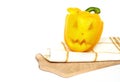 Colorful Halloween pepper with place for text. Yellow paprika monster. sweet bell peppers with cutout faces in the skin