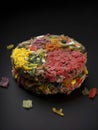 A colorful hamburger patty composed entirely of labgrown meat.. AI generation