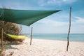 Colorful hammock in shadow on the beach. Relax on seaside. Calm sea with hammock on the shore. Chill and relaxation. Royalty Free Stock Photo