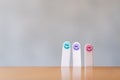 Colorful hand draw happy emotion faces on wooden stick