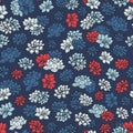 Colorful hand drawn vector lilies silhouettes seamless pattern in red and blue colors on dark navy background