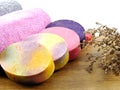 Colorful hand made fruit soap with towel on white space background Royalty Free Stock Photo