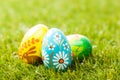 Colorful hand painted Easter eggs in grass. Spring theme Royalty Free Stock Photo