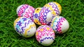 Colorful Hand-Painted Easter Eggs on Green Grass and Six Decorated Eggs for Easter Holiday Royalty Free Stock Photo