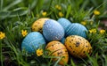 Colorful Hand-Painted Easter Eggs Nestled in Vibrant Spring Grass with Flowers Royalty Free Stock Photo