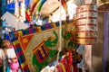 Colorful handbags, bangles, accessories, and decoration items hanging in a shop
