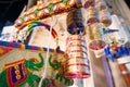 Colorful handbags, bangles, accessories, and decoration items hanging in a shop