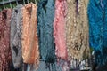 Colorful handcrafted scarves displayed at market