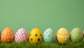 Colorful handmade easter eggs on grass on green background. AI generated. Royalty Free Stock Photo