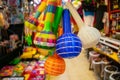 Colorful handmade rattles hanging inside a Mexican market Royalty Free Stock Photo