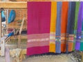 Colorful handmade scarfs with traditional decoration fabric. Manual weaving in Akha village Luang Namtha North Laos, travel Royalty Free Stock Photo