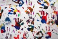 Colorful handprints hands on a white canvas